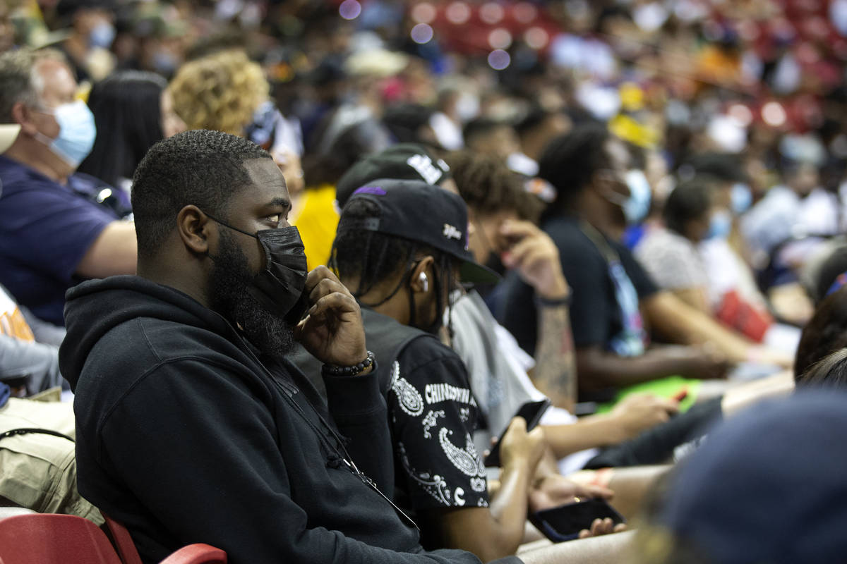 Agent and former UNLV basketball player Jordan Cornish answers a phone call while attending a N ...