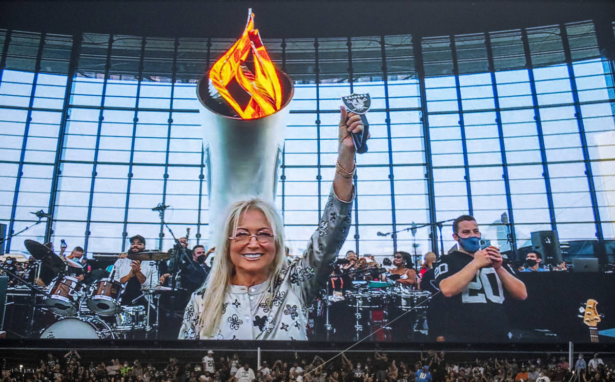 Dr. Miriam Adelson lights the Al Davis Memorial Torch Flame before the Raiders home opening pre ...