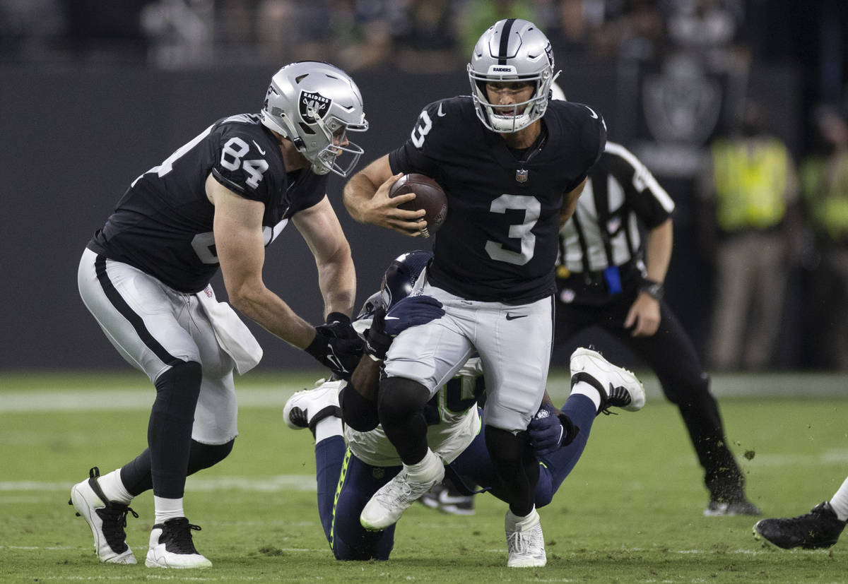 Raiders quarterback Nathan Peterman (3) scrambles in the second quarter during an NFL preseason ...