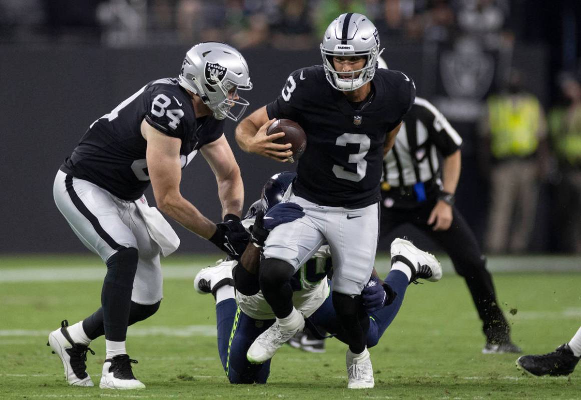 Raiders quarterback Nathan Peterman (3) scrambles in the second quarter during an NFL preseason ...