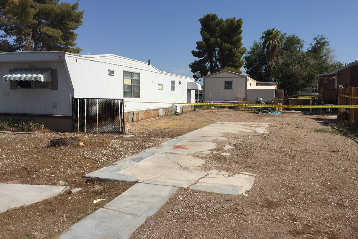 Police investigate a homicide Sunday, Aug. 15, 2021, on the 1100 block of South Mojave Road in ...