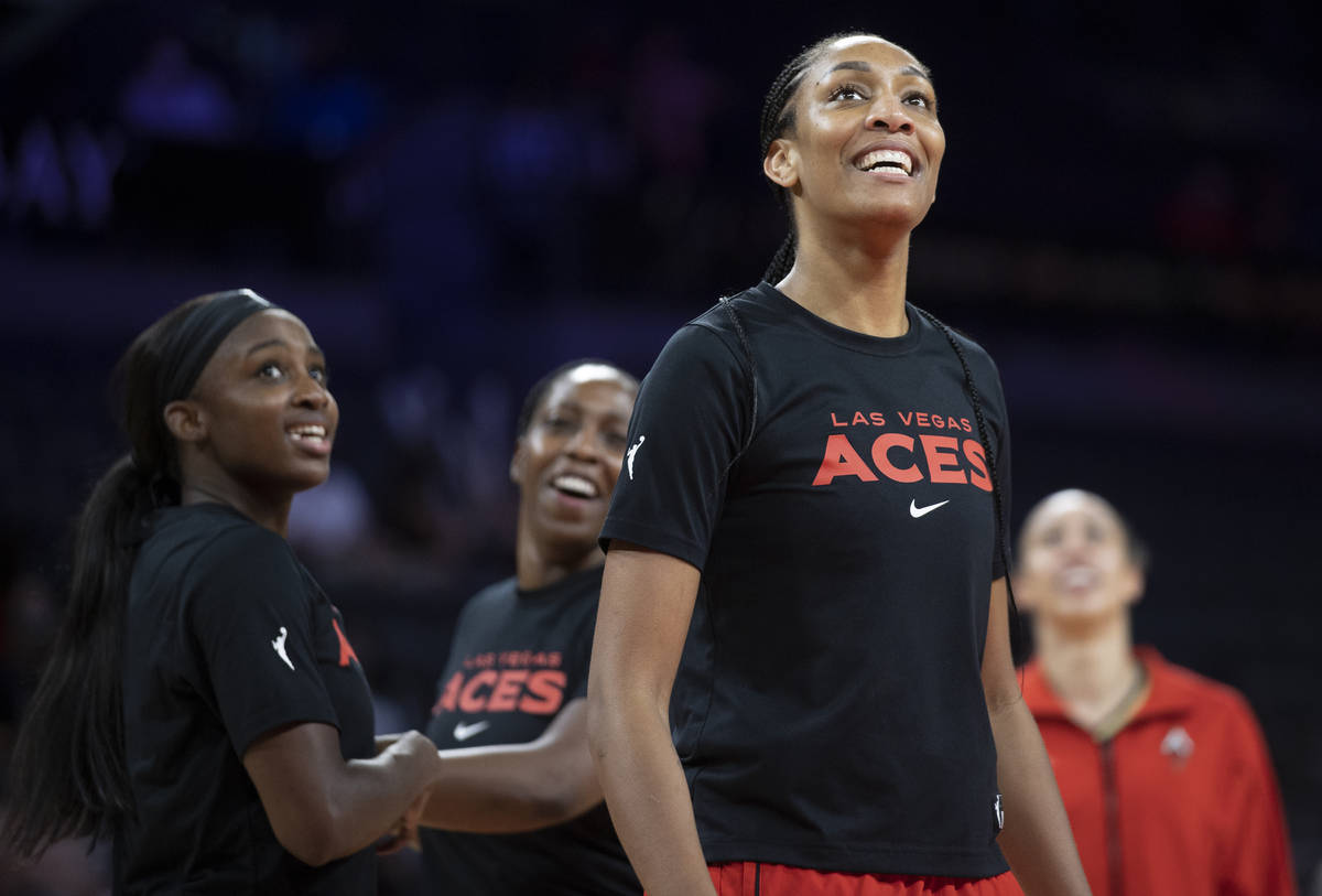 Las Vegas Aces forward A'ja Wilson (22) jokes around with teammates before the start of a WNBA ...