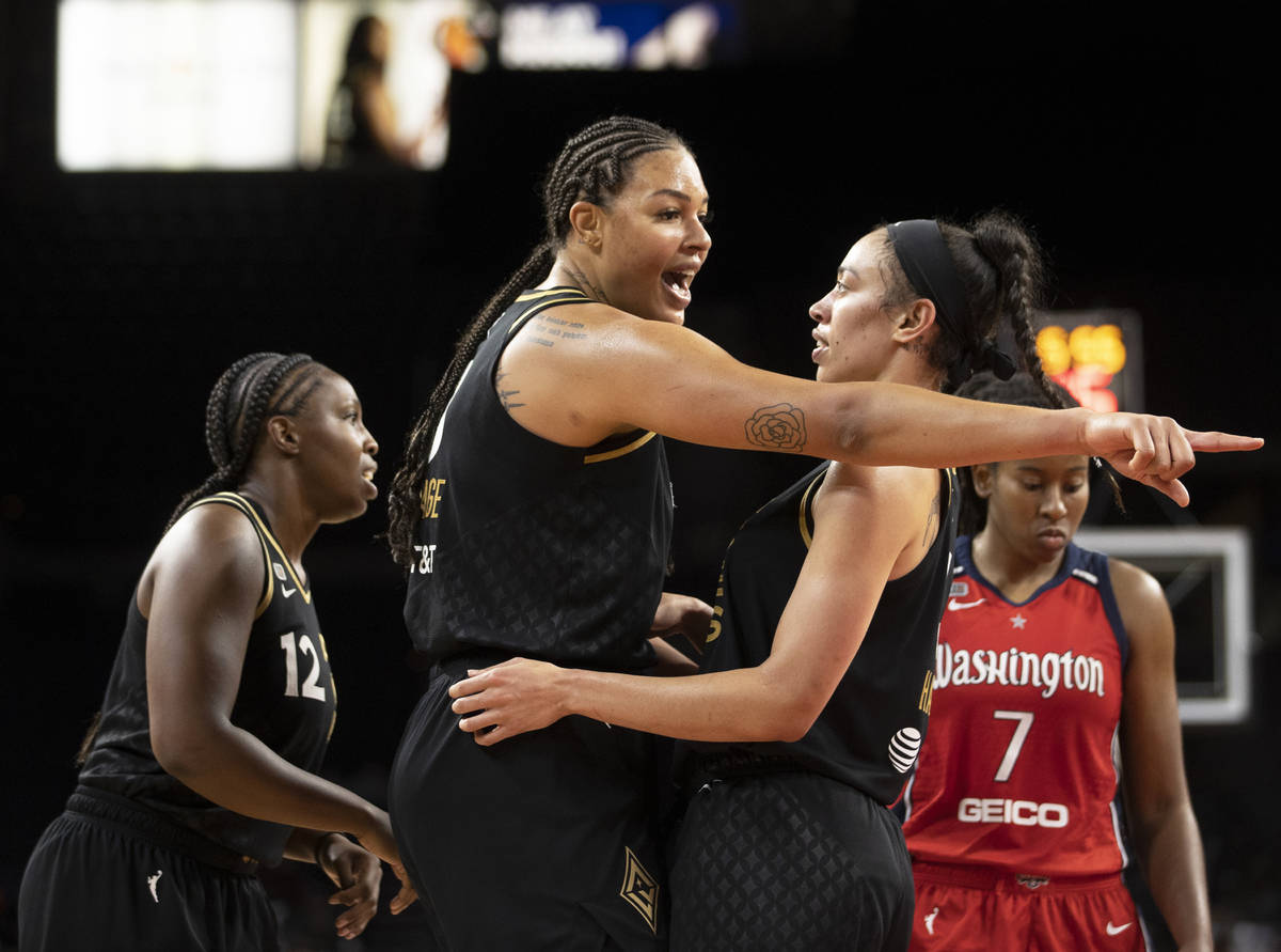 Las Vegas Aces center Liz Cambage (8) argues with Las Vegas Aces forward Dearica Hamby (5) in t ...