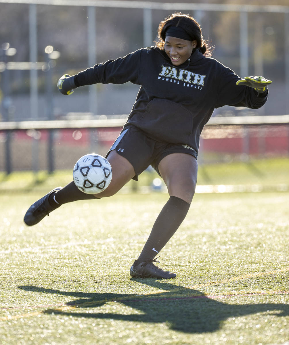 Goalkeeper Jordan Brown kicks a ball downfield during a girlÕs soccer team practice at Fai ...