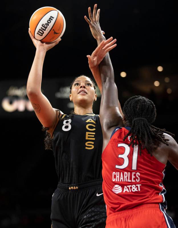 Las Vegas Aces center Liz Cambage (8) shoots over Washington Mystics center Tina Charles (31) i ...