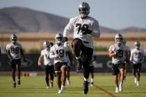 Raiders offensive tackle Alex Leatherwood (70) stretches during training camp on Monday, Aug. 2 ...