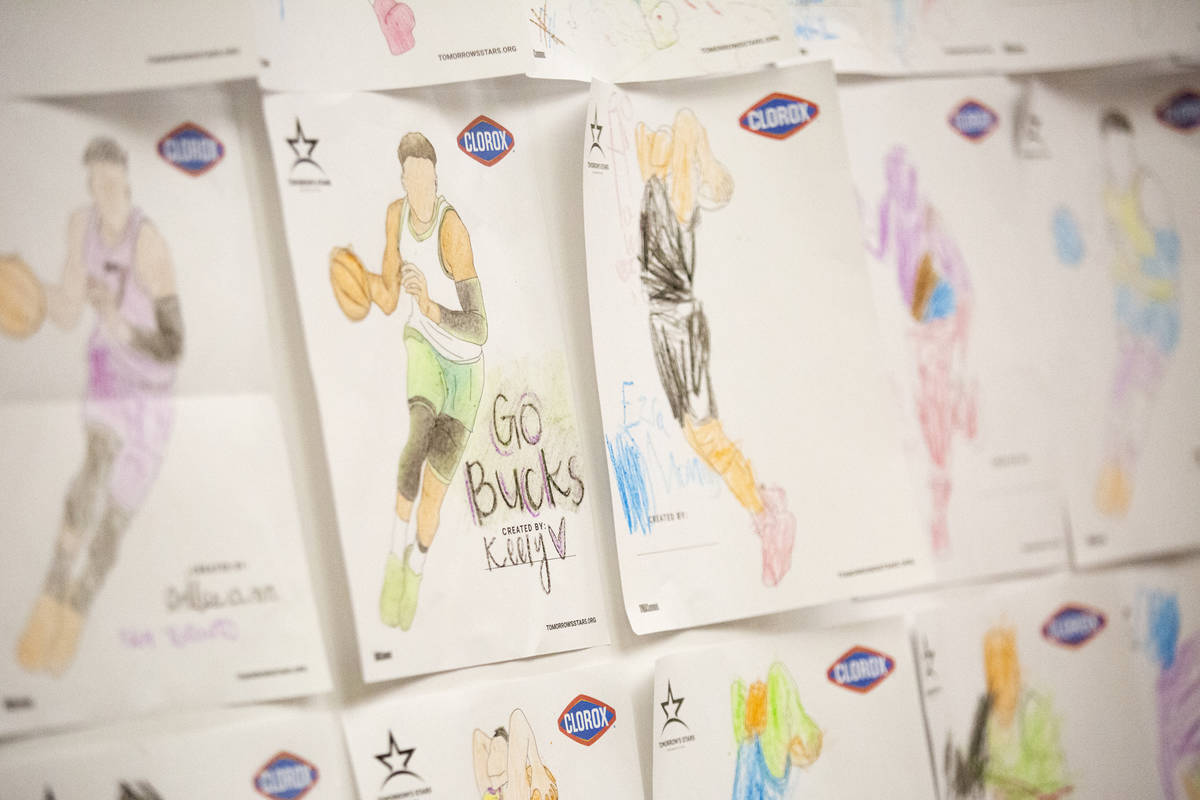 A wall of drawings by children adorn the wall on part of the concourse at the Thomas & Mack ...
