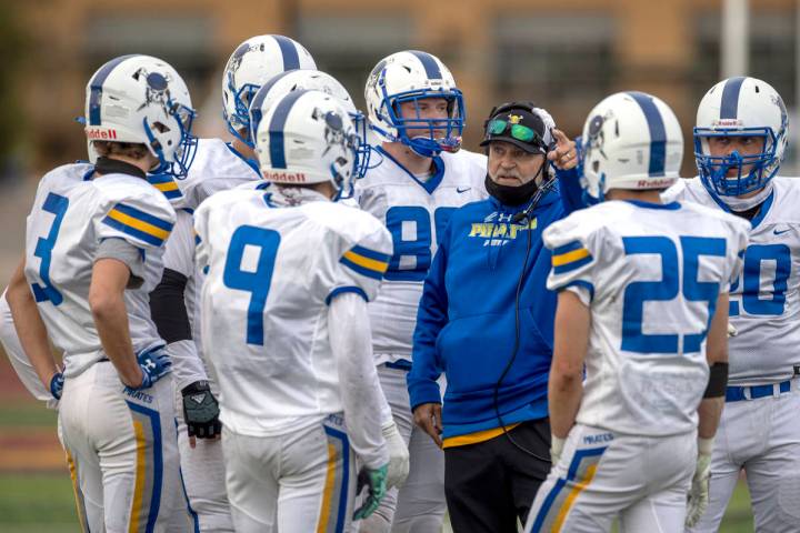 Moapa Valley football coach Brent Lewis talks to his team during a game against Faith Lutheran ...