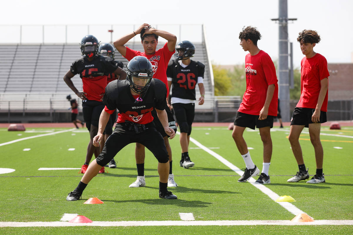 Players practice drills during football practice at Las Vegas High School in Las Vegas, Tuesday ...