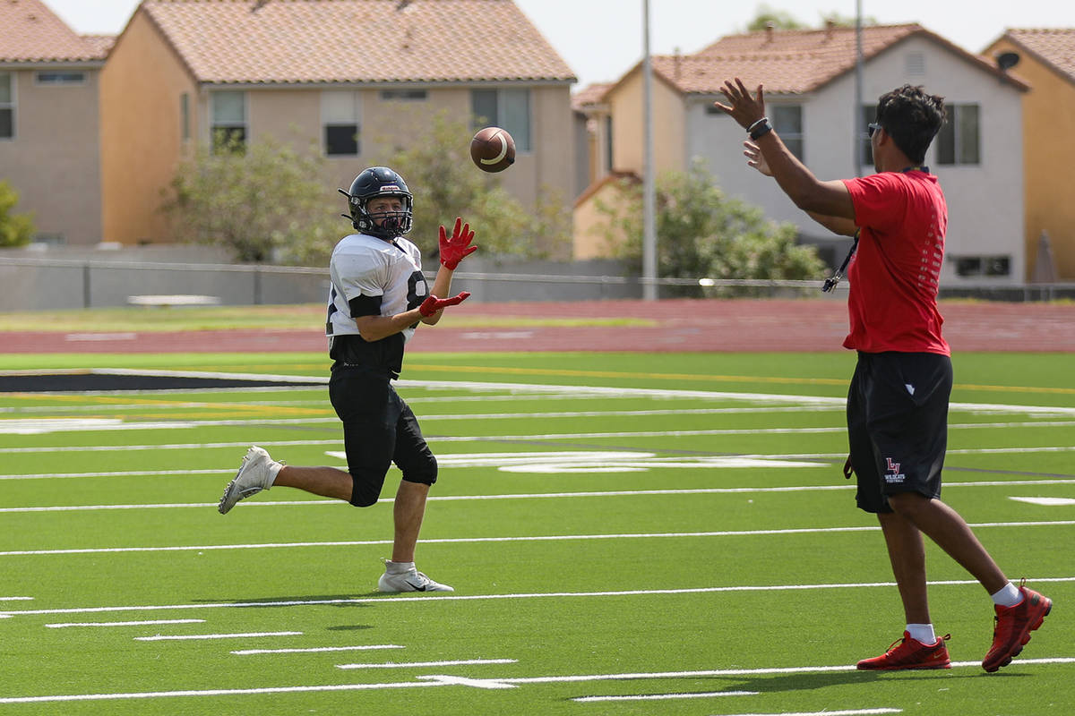 Jordan Dishmon catches the ball during football practice at Las Vegas High School Tuesday, Aug. ...