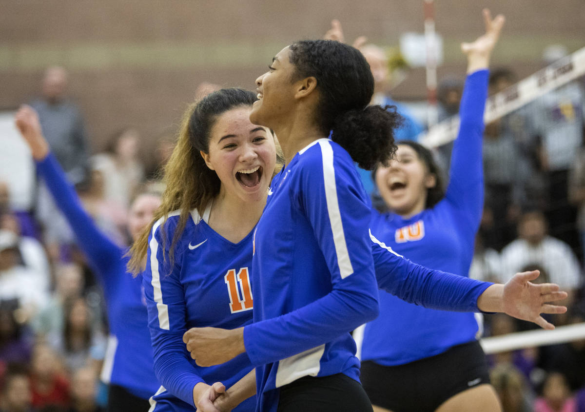 Bishop Gorman High School's Caroline Edgeworth (11) cheers with her teammate Kyndaal Stansberry ...