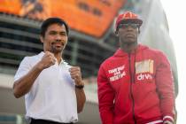 Manny Pacquiao, left, and Yordenis Ugas, pose during their grand arrival event at Toshiba Plaza ...