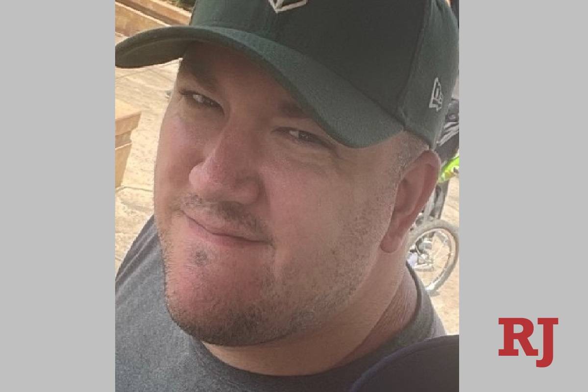 Mike Freedy, 39, during a family vacation in July. His fiancee suspects he contracted COVID-19 ...