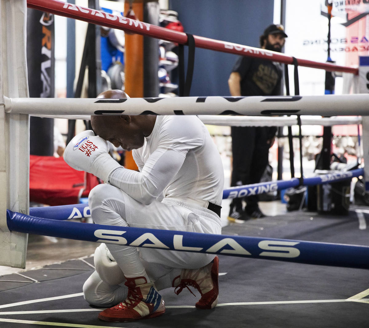 Welterweight Yordenis Ugas prays before the start of a training session for his upcoming fight ...