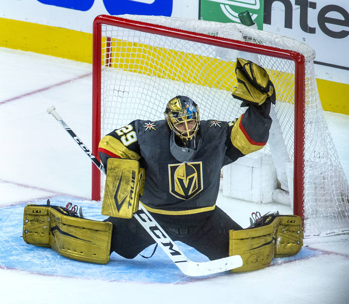 Golden Knights goaltender Marc-Andre Fleury reaches up for another stop versus the Minnesota Wi ...