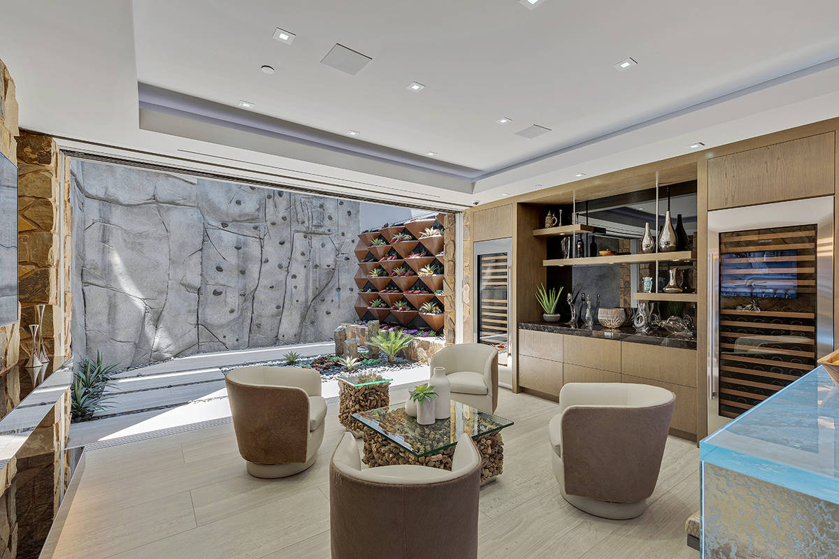 The home has a two-story rock-climbing wall in the basement. (The Ivan Sher Group)