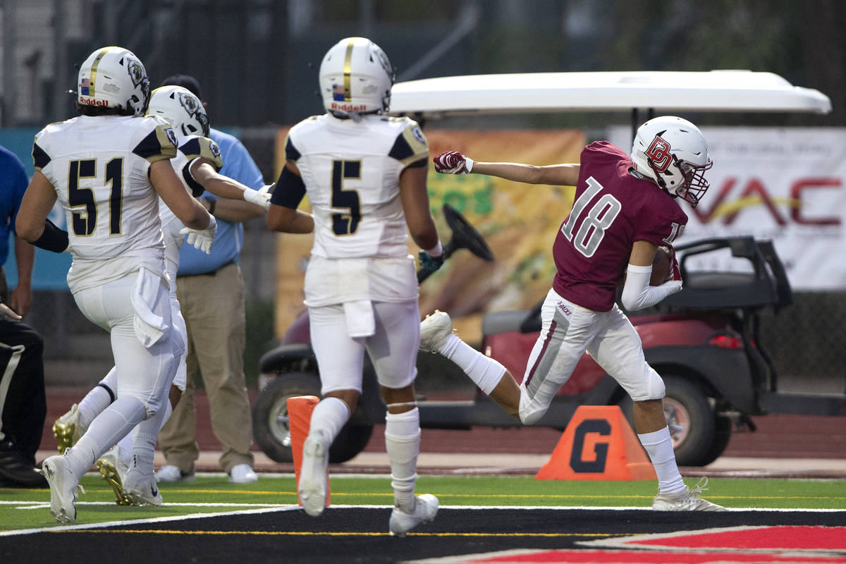 Desert Oasis wide receiver Avery Aliaga (18) scores a touchdown against Spring Valley during a ...