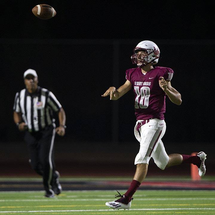 Desert Oasis quarterback Tyler Stott (10) passes during a high school football game against Spr ...