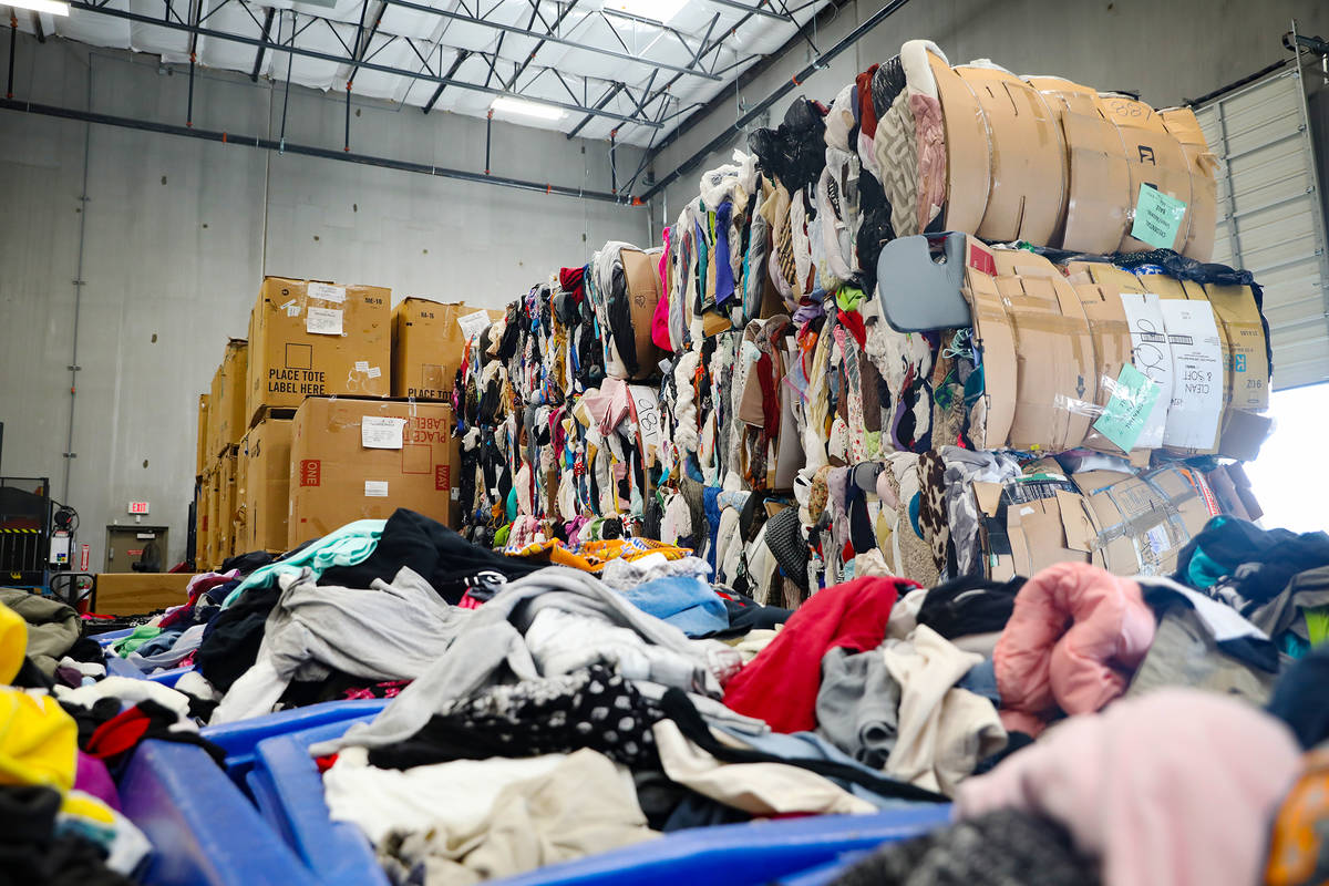 Bales of clothes at the warehouse at the Goodwill Clearance Center in Las Vegas, Monday, Aug. 1 ...