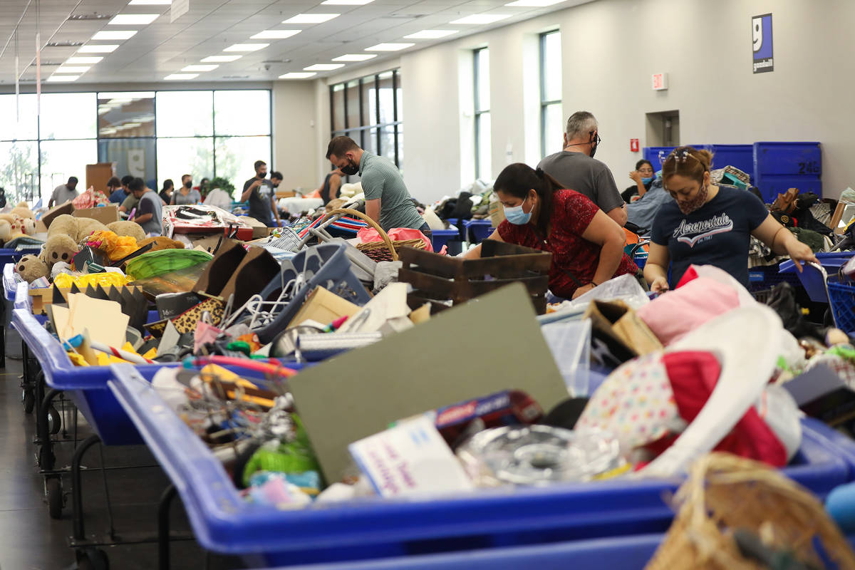 Shoppers dig through items in the thrift store portion of the Goodwill Clearance Center in Las ...