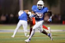 Bishop Gorman's William Stallings Jr. (25) runs the ball during the second quarter of a footbal ...