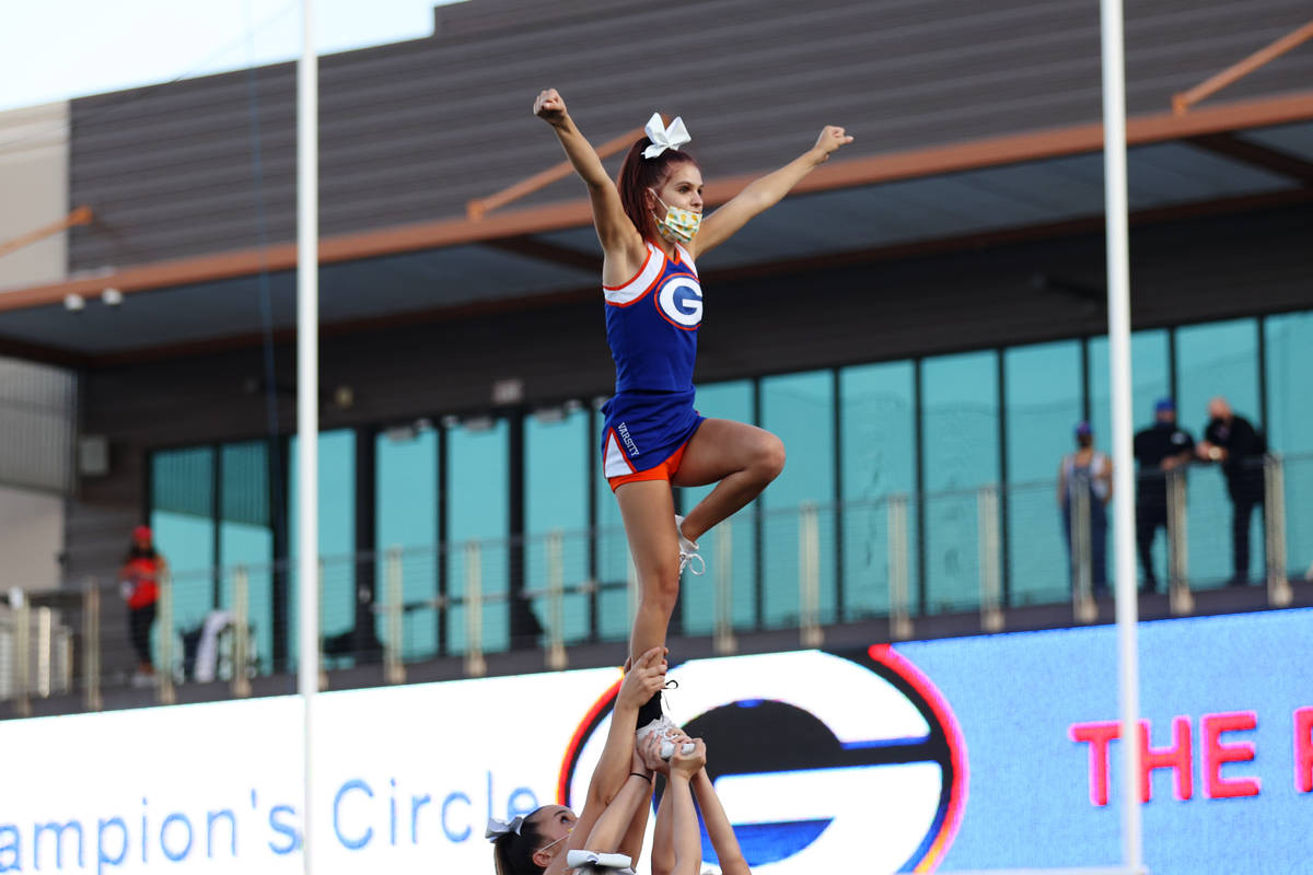 Cheerleaders perform before the start of a football game between Bishop Gorman and St. Louis of ...