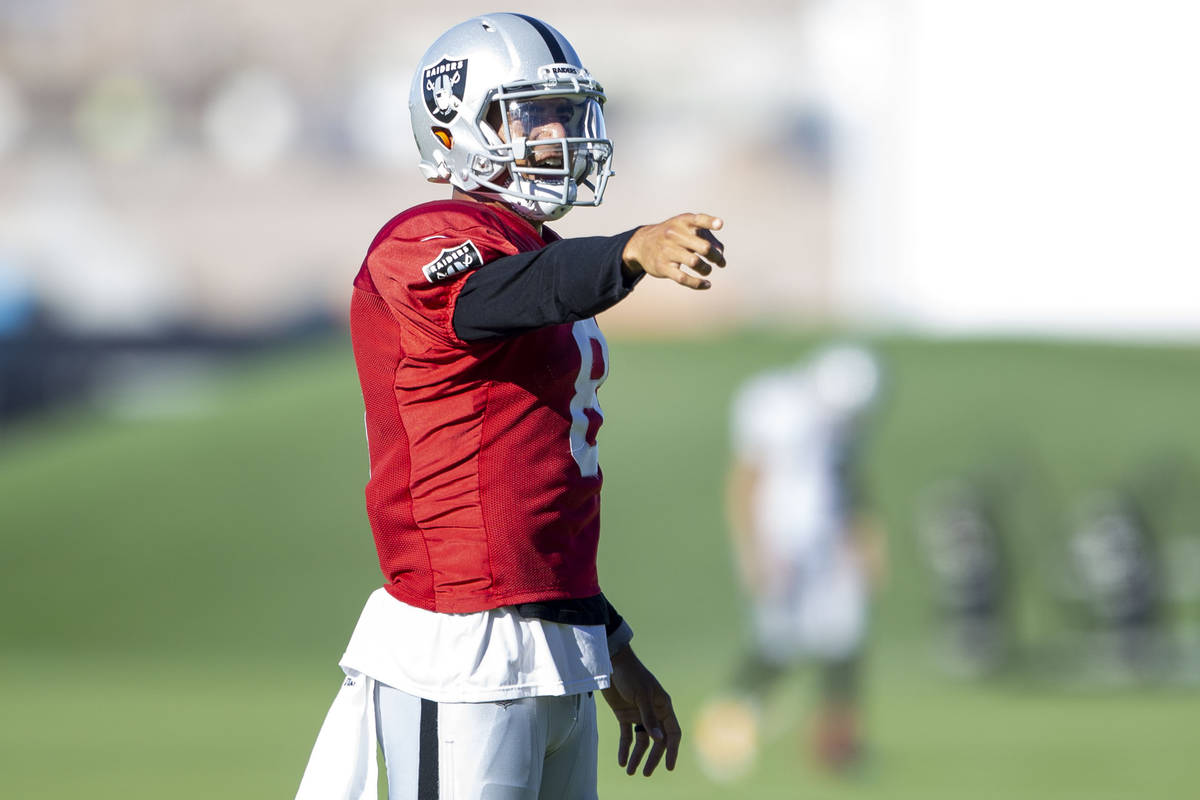 Raiders quarterback Marcus Mariota (8) reacts after throwing a pass during their NFL training c ...