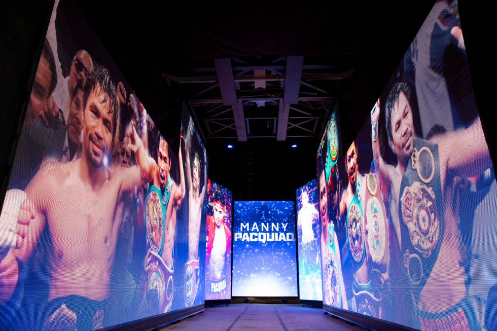 Screens at the start of the boxing ring walk are seen in advance of the main event between Mann ...