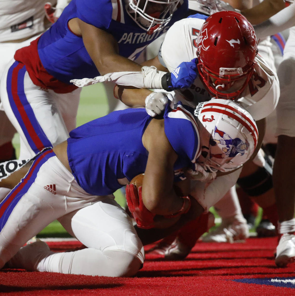 Liberty High School's Larry Royal (3) scores a touchdown over Arbor View High School's Talavout ...