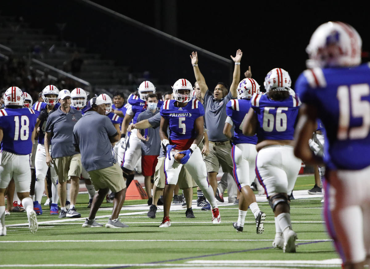Liberty High School Anthony Jones (5) celebrates his touchdown during the first half of a footb ...