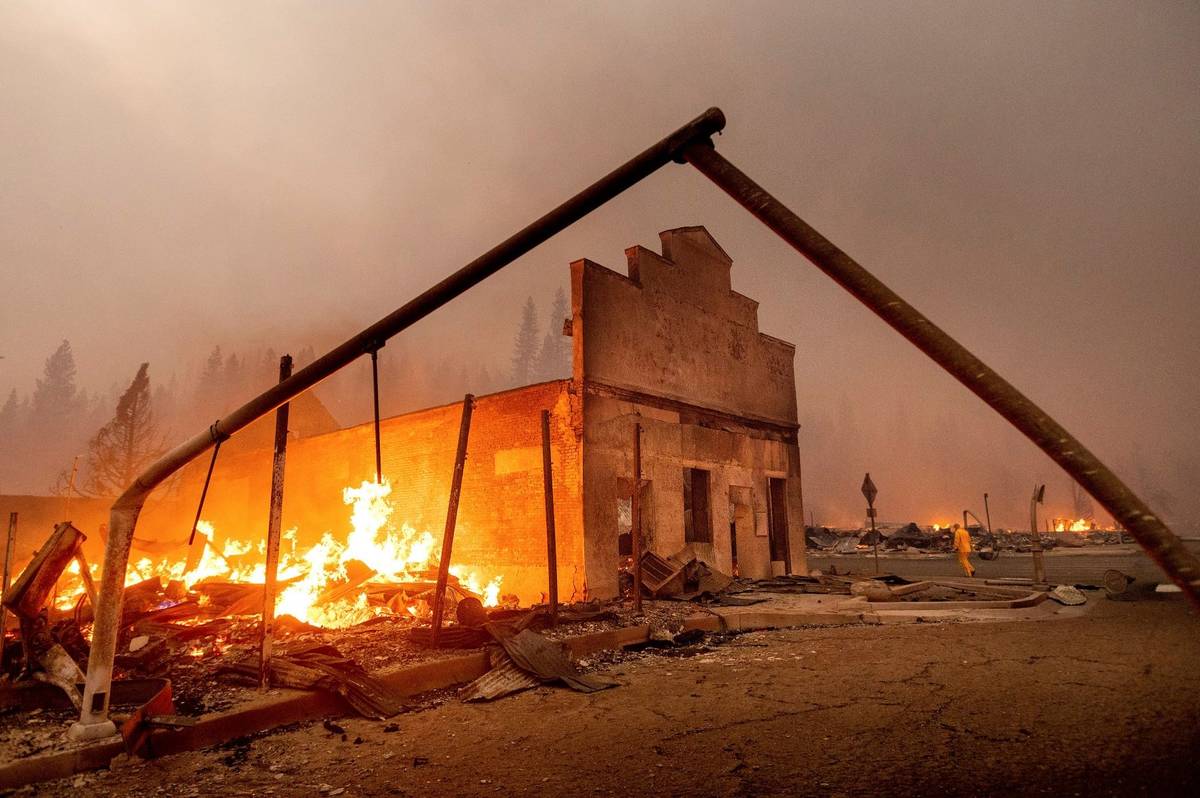 The Way Station Bar burns as the Dixie Fire tears through the Greenville community of Plumas Co ...