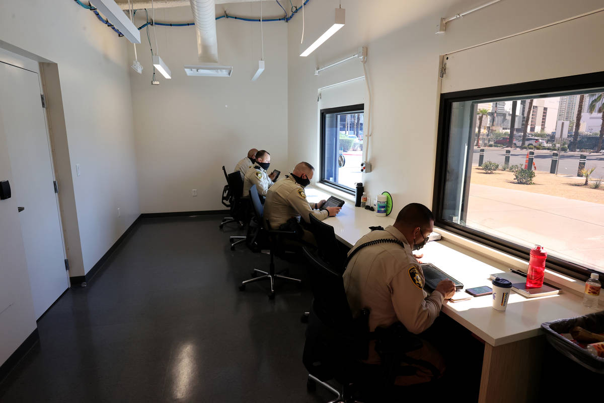 Las Vegas police officers, including from right, Ricky Lara, James Knowlton, Brett Robbins and ...