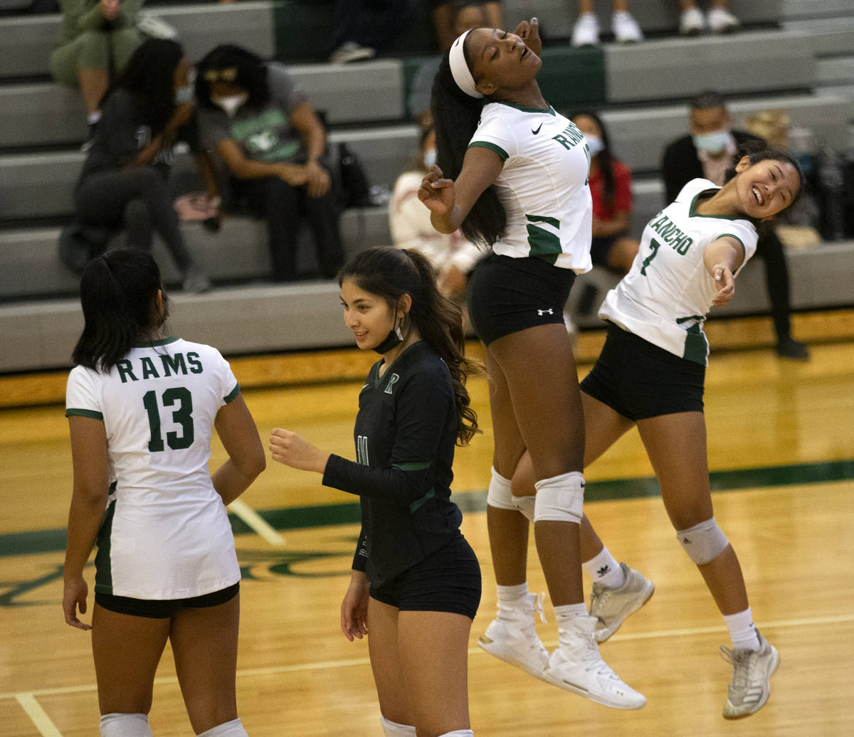 Rancho's Leah Miller (10) and Jan Marie Duhaylungsod (7) celebrate an ace earned by Duhaylungso ...