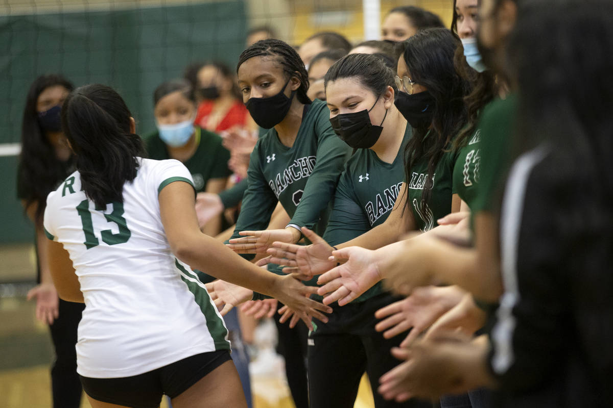 Rancho's Gabriella Fernandez (13) is greeted by teammates as her team's starting lineup is anno ...