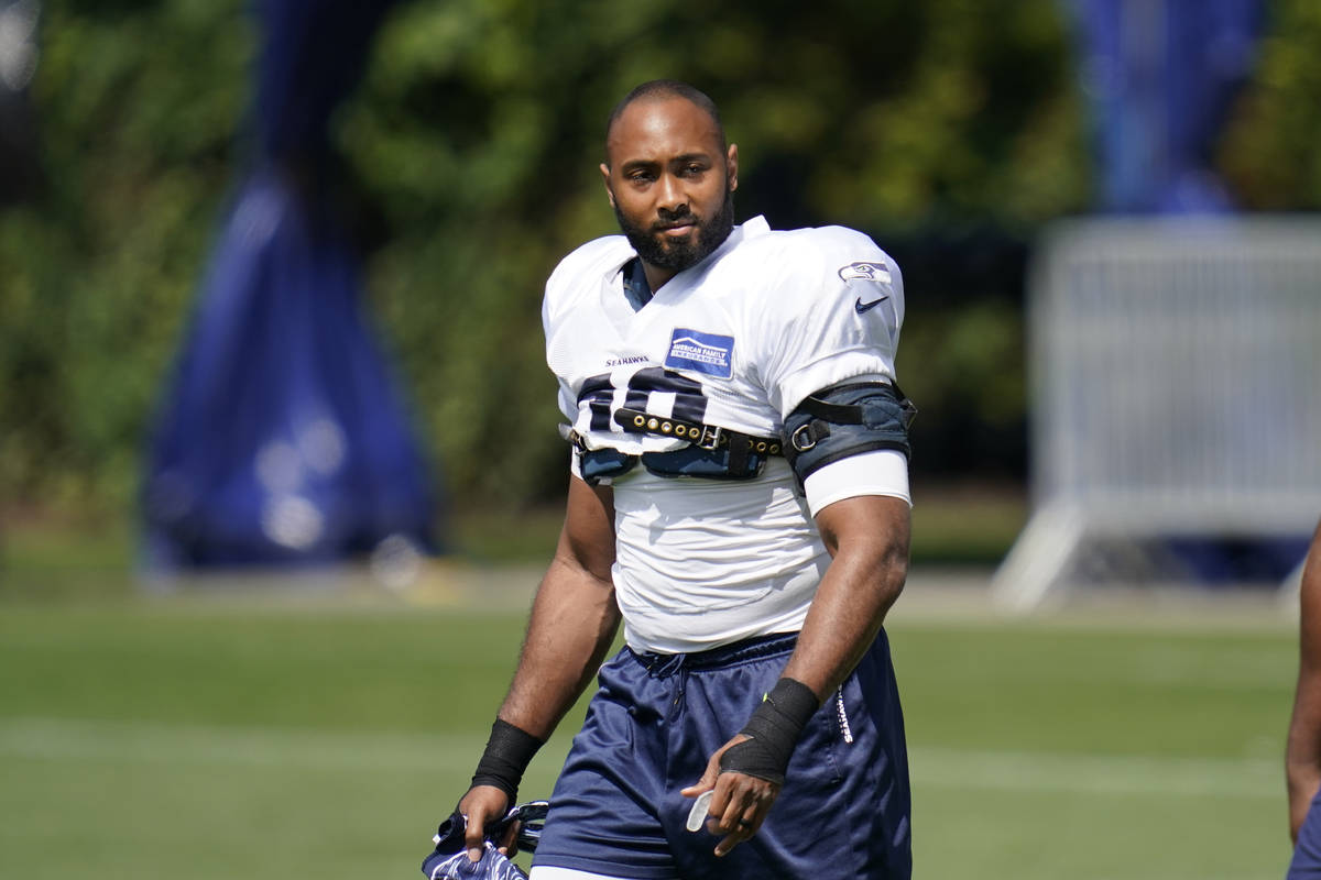 Seattle Seahawks linebacker K.J. Wright walks on the field Tuesday, Aug. 18, 2020, during an NF ...
