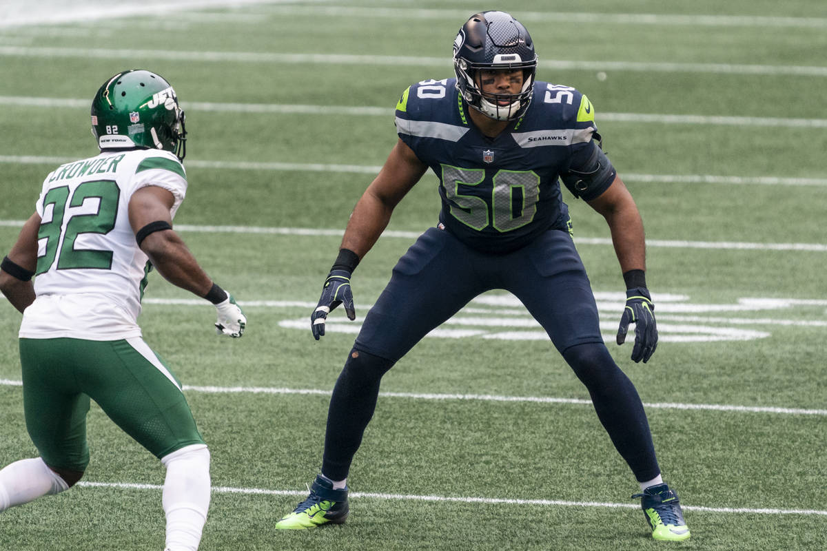 In this Sunday, Dec. 13, 2020, file photo, Seattle Seahawks linebacker K.J. Wright plays a snap ...