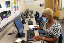 Marlisha Wysinger, who has two children enrolled at Nevada Learning Academy at CCSD, fills out ...