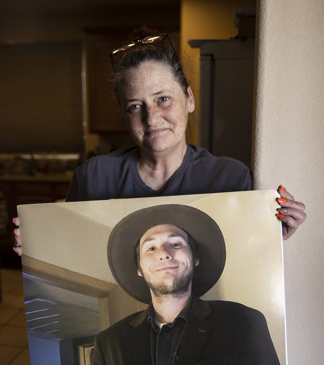 Kassy Robinson holds her son Roy Jaggers' photograph at her Las Vegas home on Saturday, Aug. 21 ...