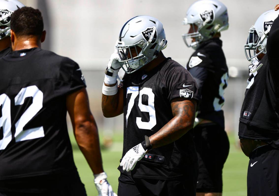 Raiders defensive tackle Darius Stills (79) adjusts his helmet during NFL football practice at ...