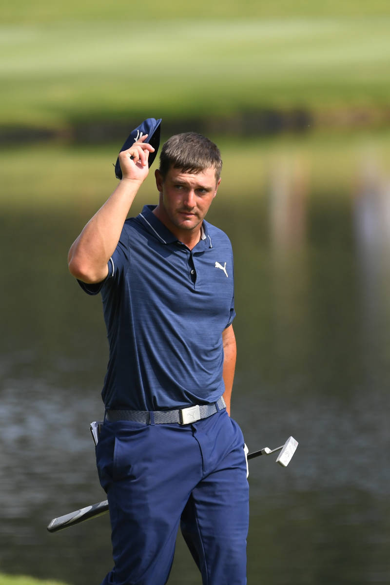 Bryson Dechambeau walks up to the18th green during the third round in the World Golf Championsh ...