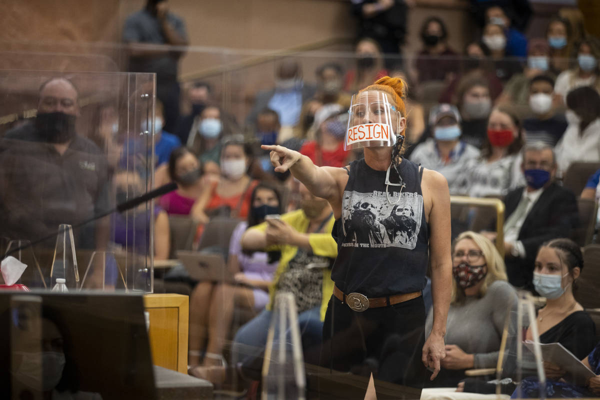 Stephanie Kinsley speaks out of order before getting escorted out of a Clark County School Dist ...
