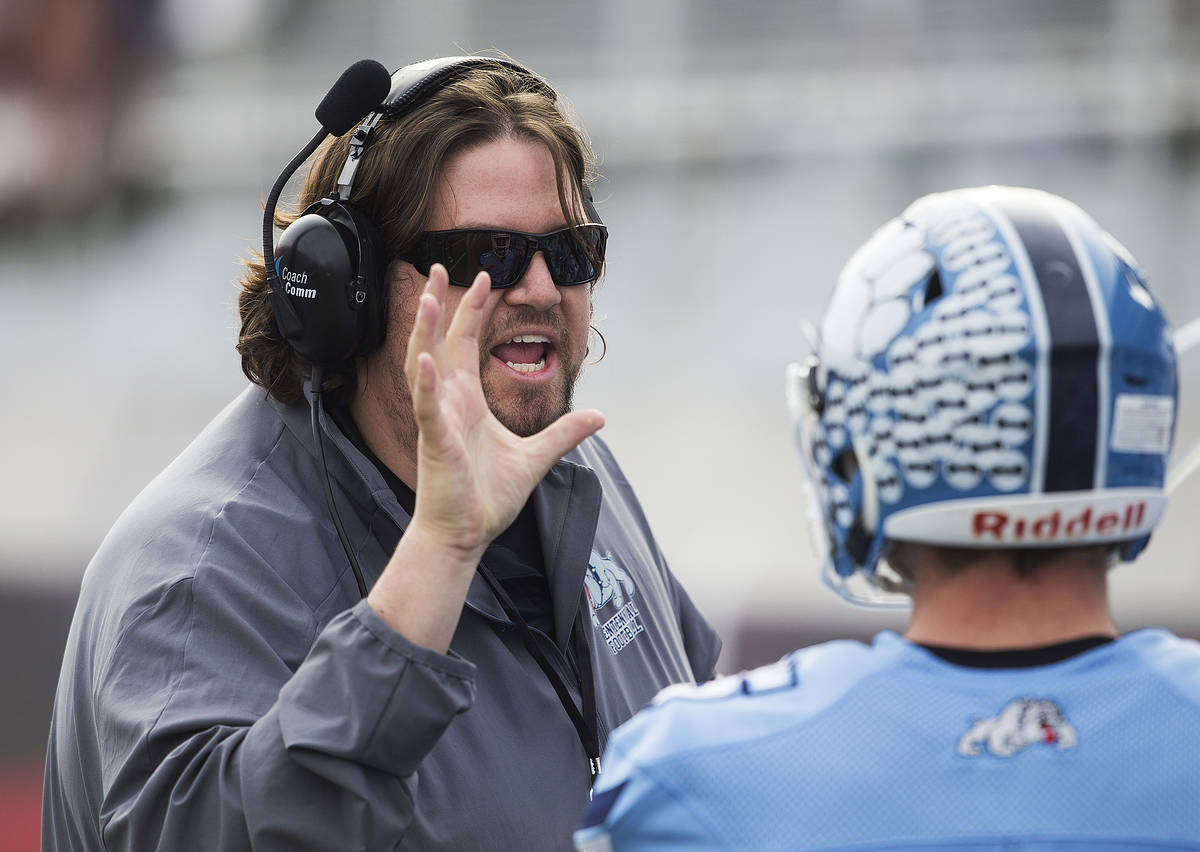 Centennial head coach Dustin Forshee coaches up his players in the first quarter during the Cla ...