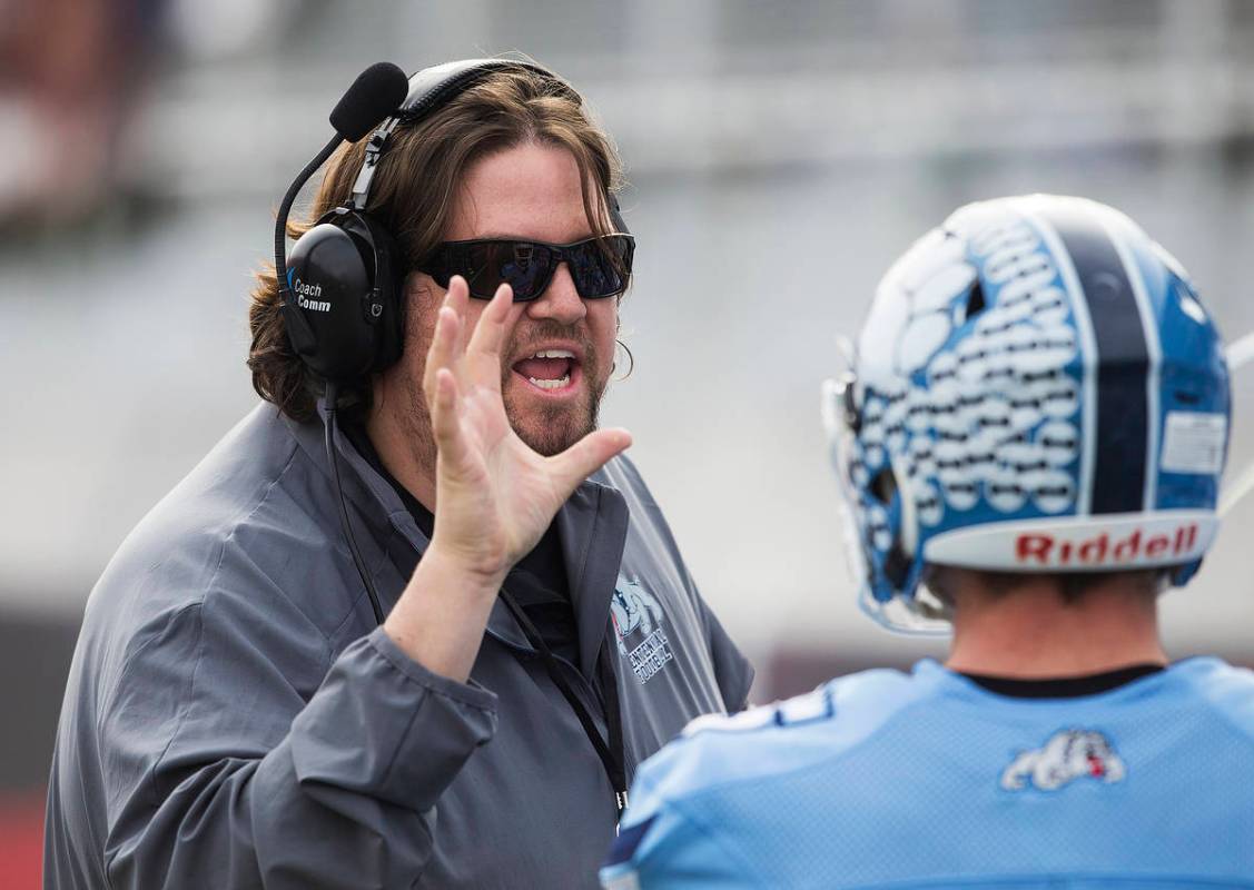 Centennial head coach Dustin Forshee coaches up his players in the first quarter during the Cla ...