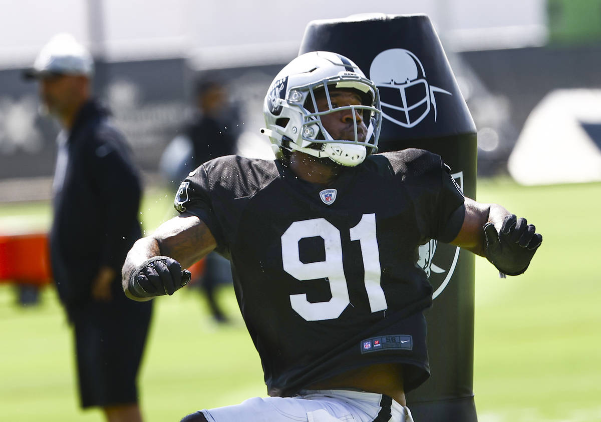 Raiders defensive end Yannick Ngakoue participates in drills during training camp at Raiders He ...