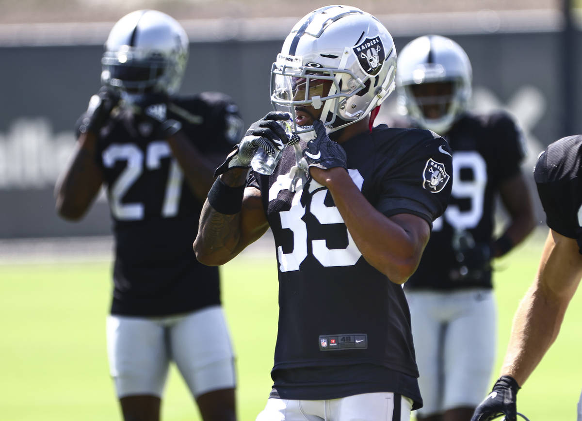 Raiders cornerback Nate Hobbs (39) hydrates during training camp at Raiders Headquarters/Interm ...