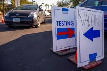 Cars are directed to specific lanes at the drive-thru COVID-19 tests and vaccinations site offe ...