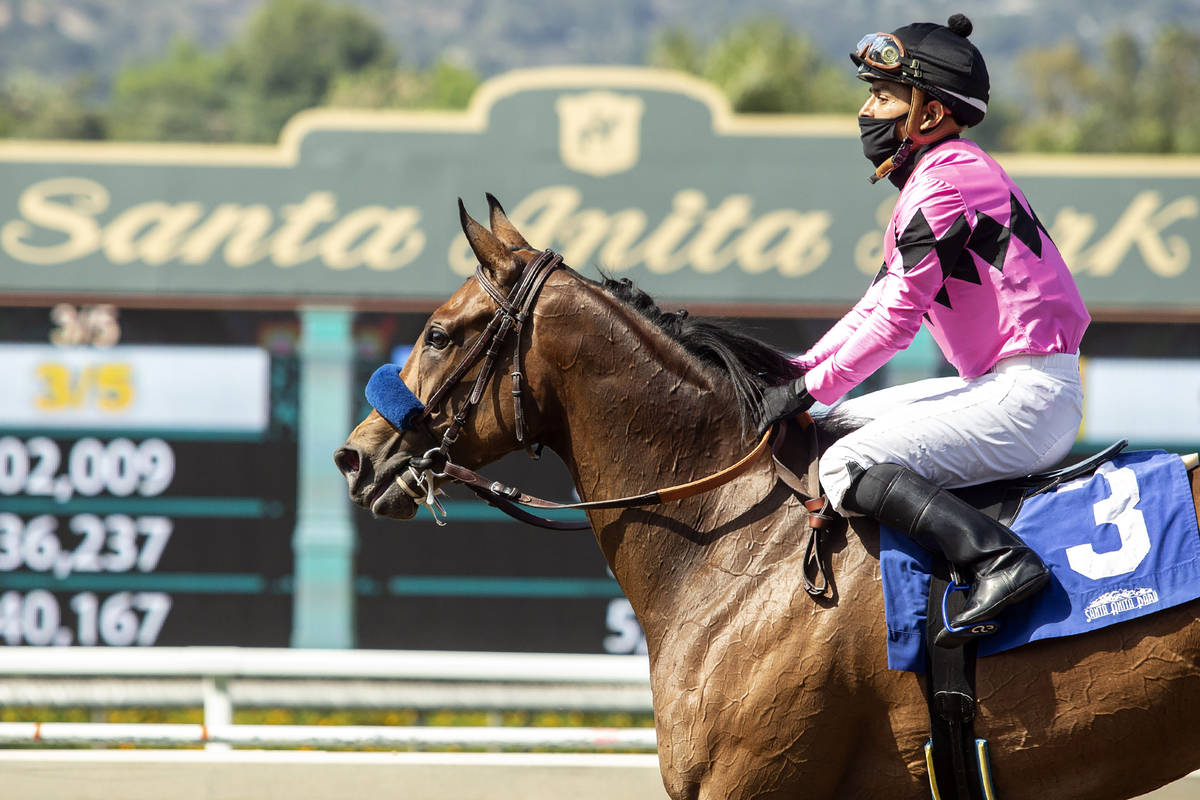 Abel Cedillo, top, leads Fighting Mad to the Winner's Circle after their victory in the Grade I ...