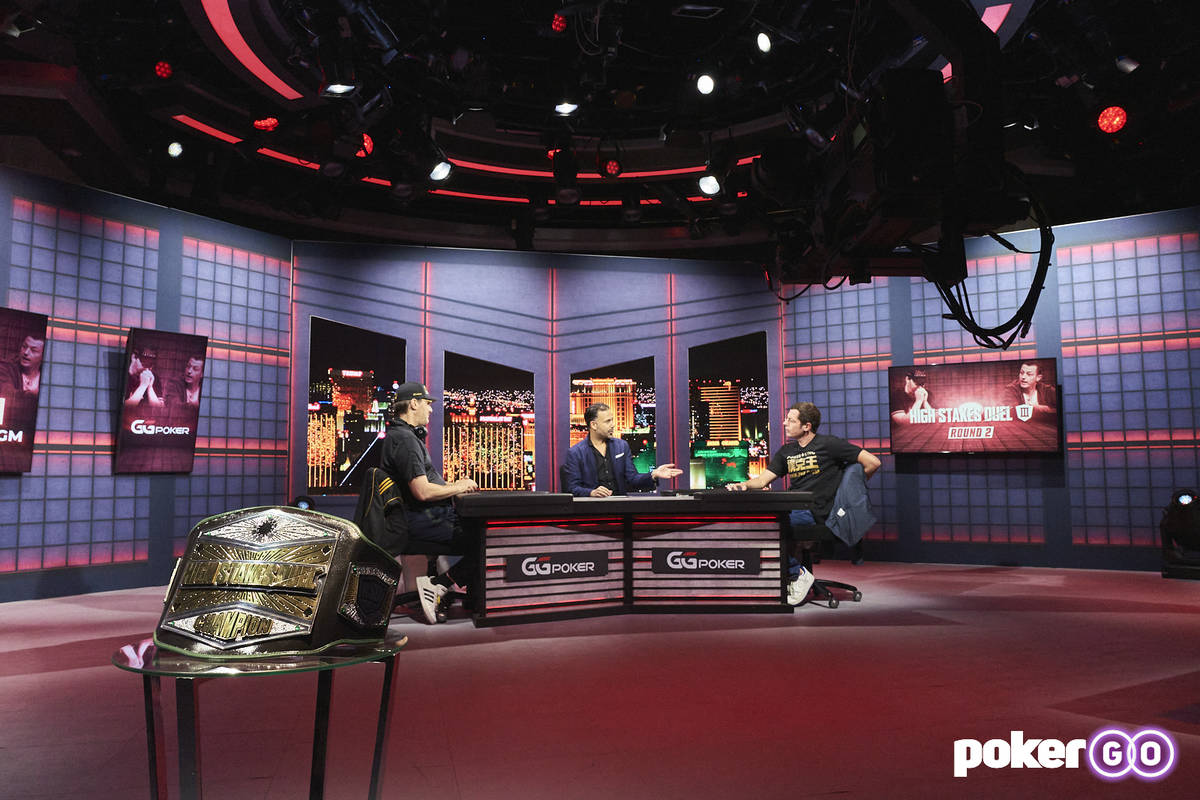 Phil Hellmuth, left, and Tom Dwan, right, talk with host Ali Nejad before their "High Stakes Du ...