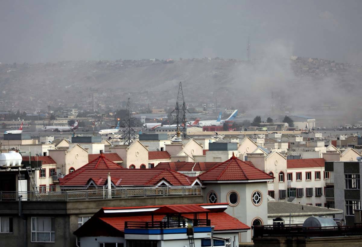 Smoke rises from a deadly explosion outside the airport in Kabul, Afghanistan, Thursday, Aug. 2 ...