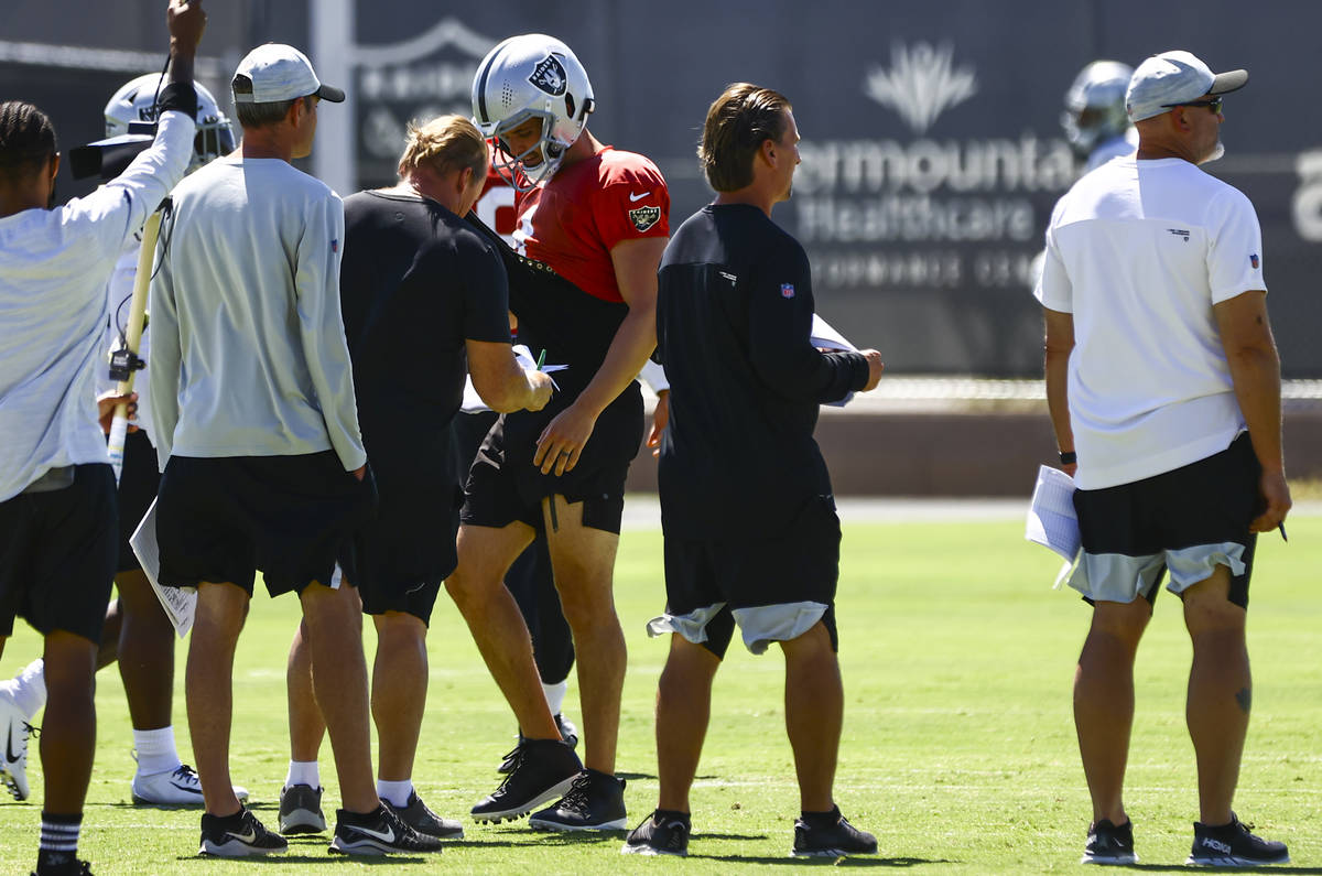 Raiders offensive coordinator Greg Olson, center right, watches practice as quarterback Derek C ...